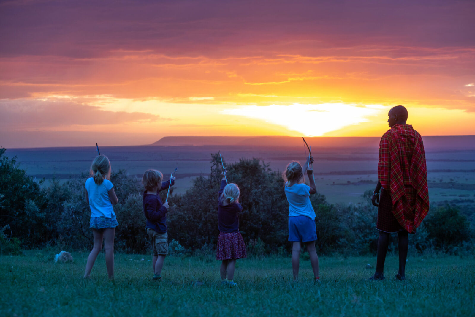 House in the Wild Maasai safari guide with kids during sunset
