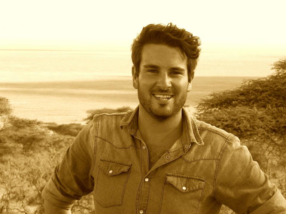 Sepia image of True Africa director, Troy Smith, in Tanzania. Acacia trees and the ocean can be seen in the background | True Africa | Blog | Troy Smith's travel archives
