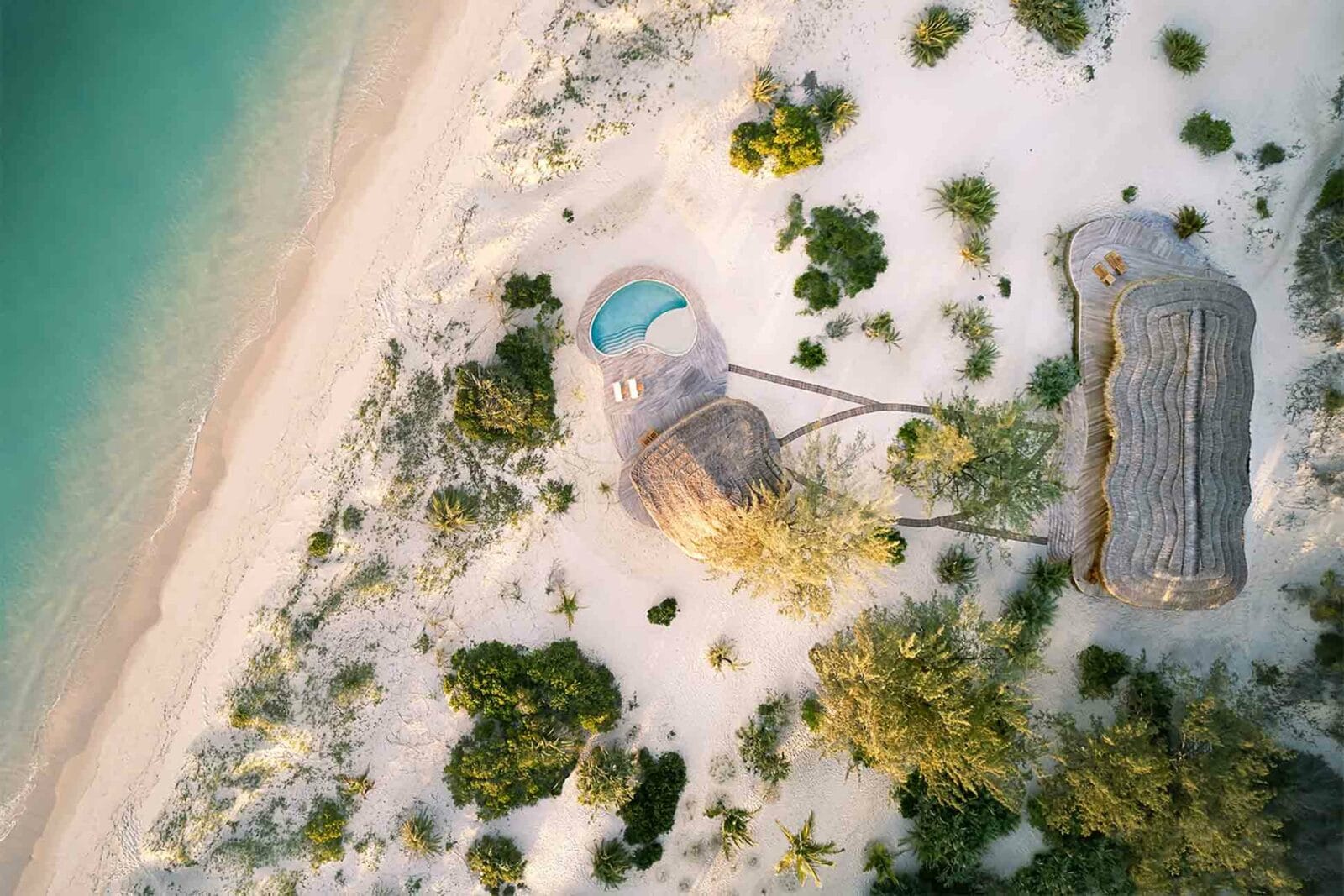 drone view from above Kisawa Sanctuary Benguerra Mozambique of the shoreline and accommodation