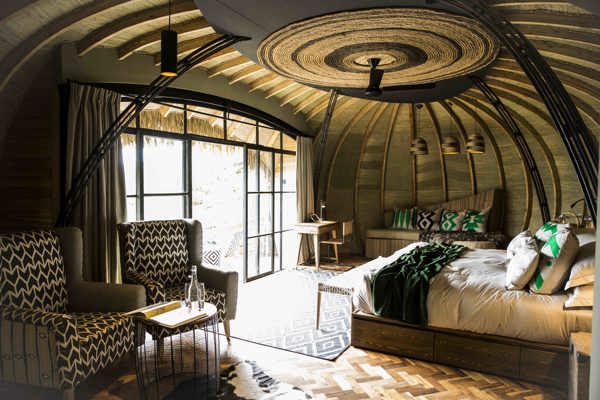 Vast bedrooms with comfy chairs and balconies, Bisate Lodge, Wilderness Safari, Rwanda