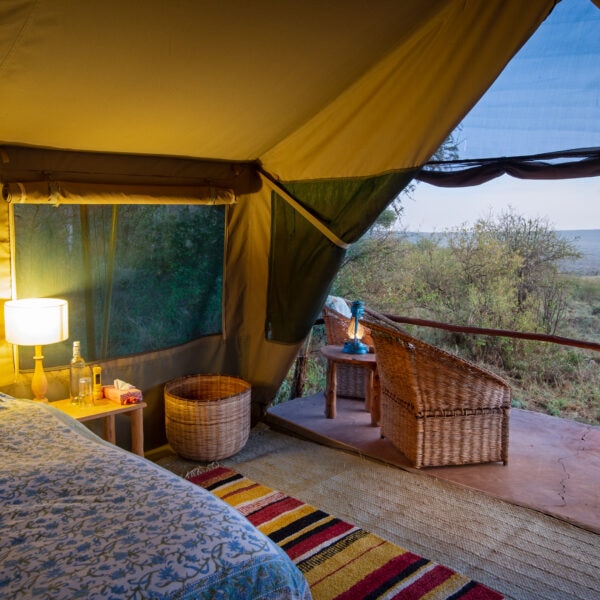 Photo of Laikipia Wilderness Camp in Northern Kenya showing the guest tent interior at night