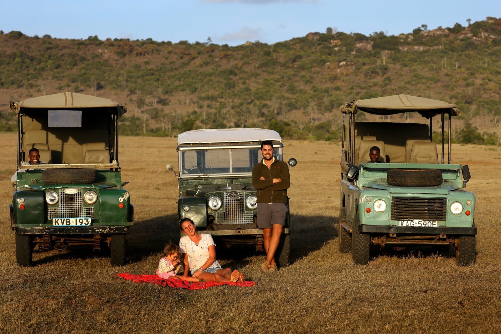 The Hough family & team members, with their three Land Rover vehicles, Kenya